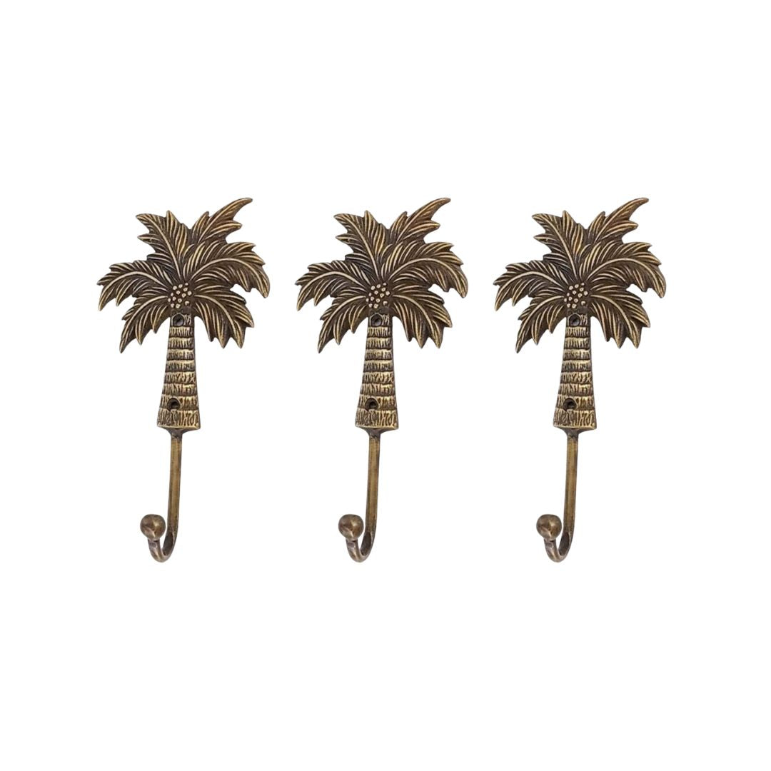 Three palm tree-shaped hooks on a white background