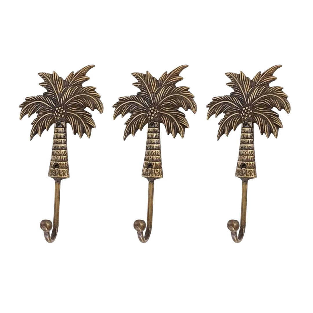 Three palm tree-shaped hooks on a white background