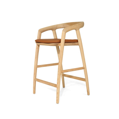 Wooden bar stool with brown seat on a white background