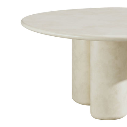 Organic White microcement marble dining table with unique base design on a white background