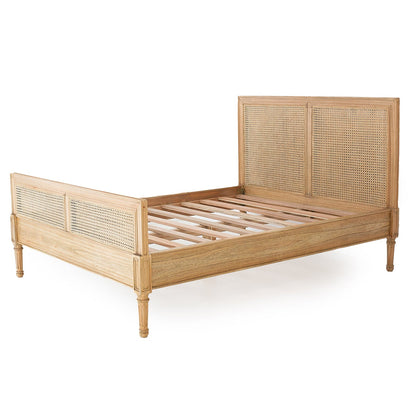 Wooden bed frame with wicker headboard on a white background