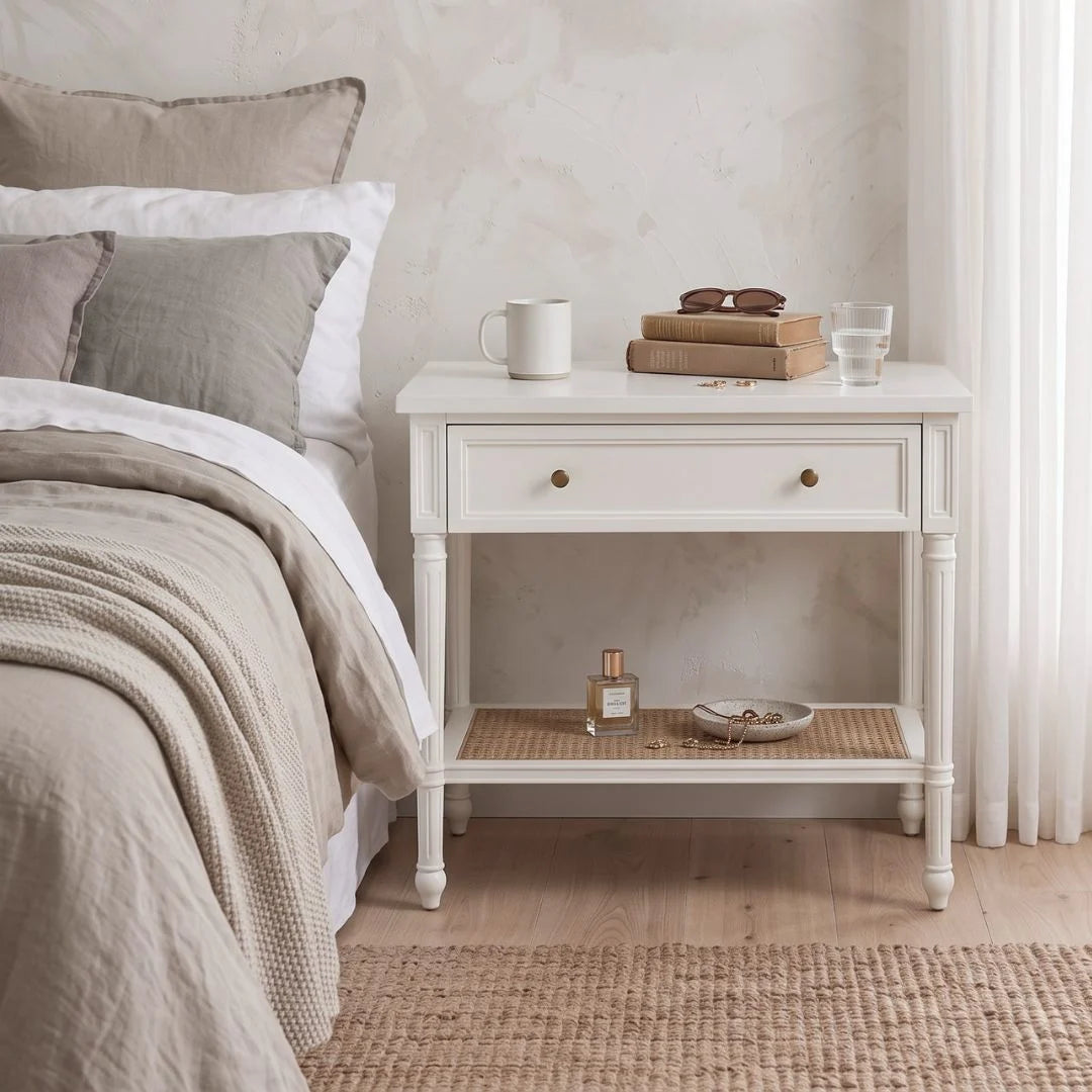 Sun Republic white nightstand bedside table in a modern bedroom setting