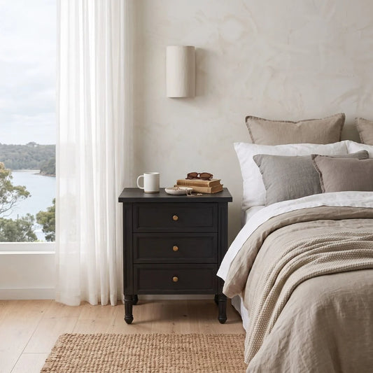 Black Timber 3 drawer bedside Table in a modern styled bedroom