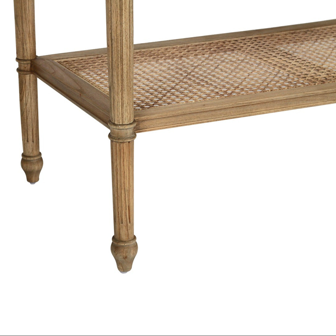 A rustic wooden bench with a woven cane seat and turned legs, shown against a plain white background.