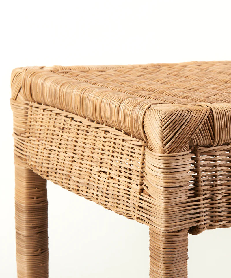 Wicker stool with a natural woven design on a white background