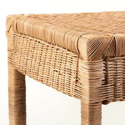 Wicker console 
with a natural woven design on a white background