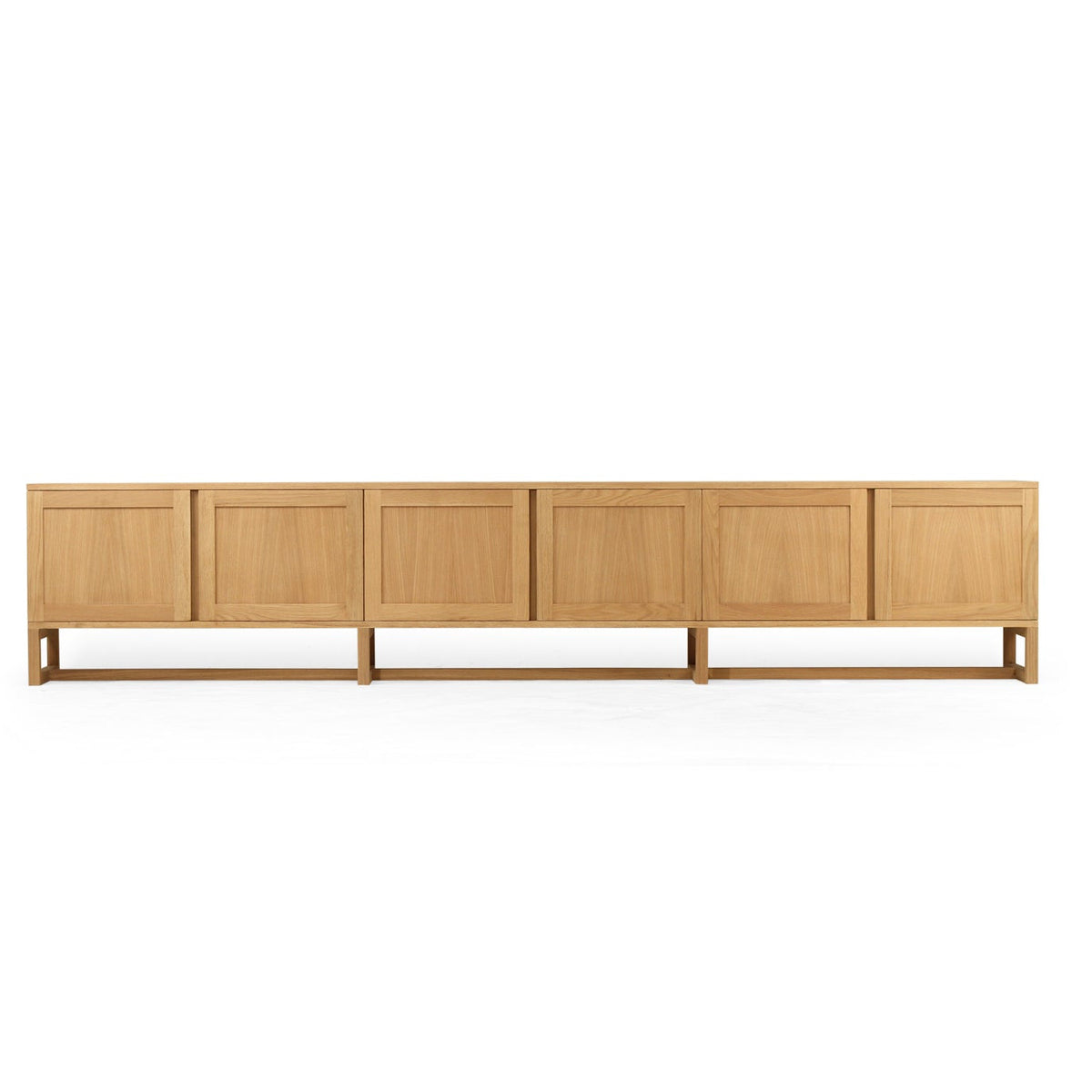 A modern six-panel sideboard cabinet in light oak wood, shown from a front-facing perspective against a solid white background.