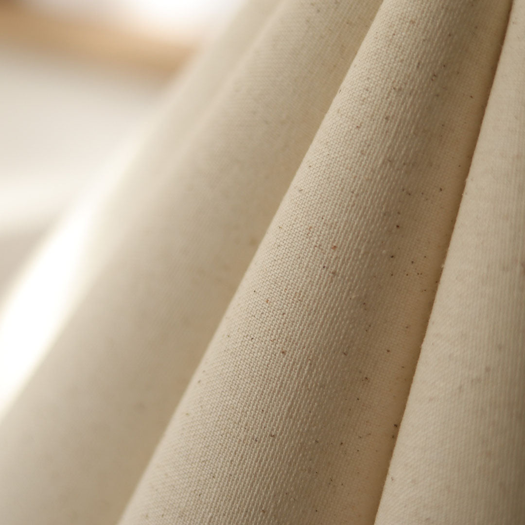 Cora Table lamp with a white pleated shade and gold curved base