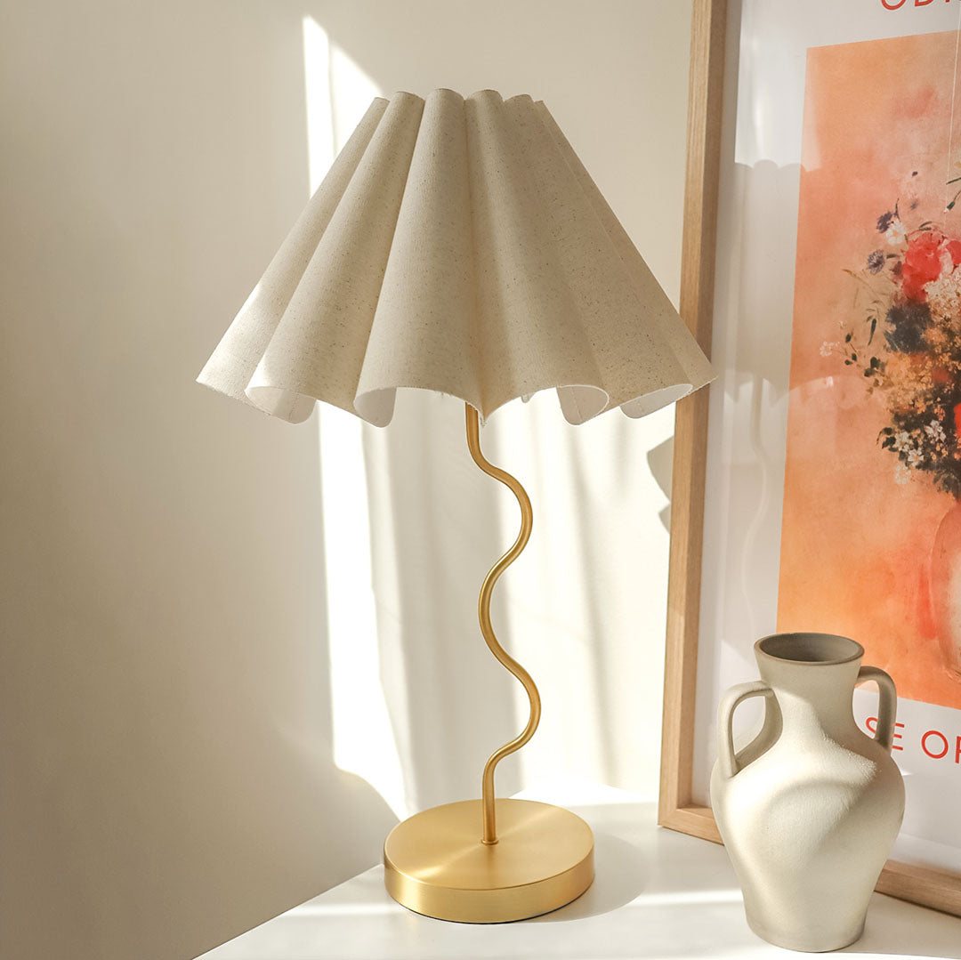 Cora Table lamp with a white pleated shade and gold curved base