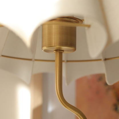 Cora Table lamp with a white pleated shade and gold curved base