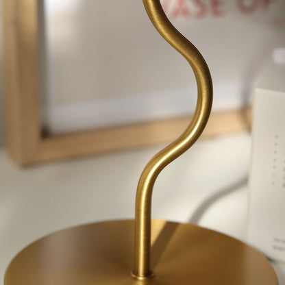 Cora Table lamp with a white pleated shade and gold curved base