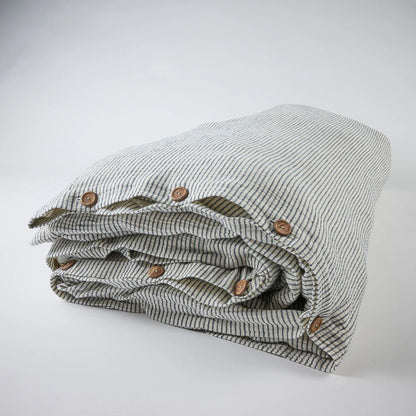 Cotton duvet cover in white and ink blue pin stripe and timber button detail