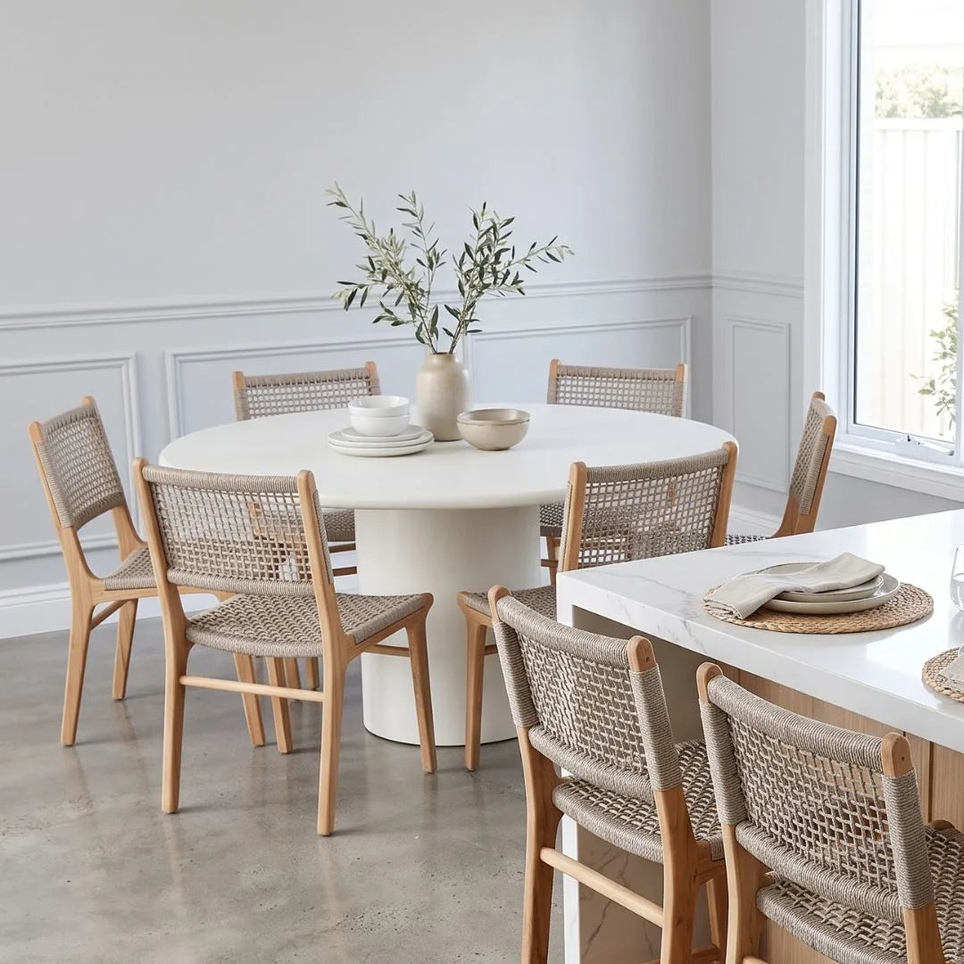 Dining room with round table and chairs in a bright room