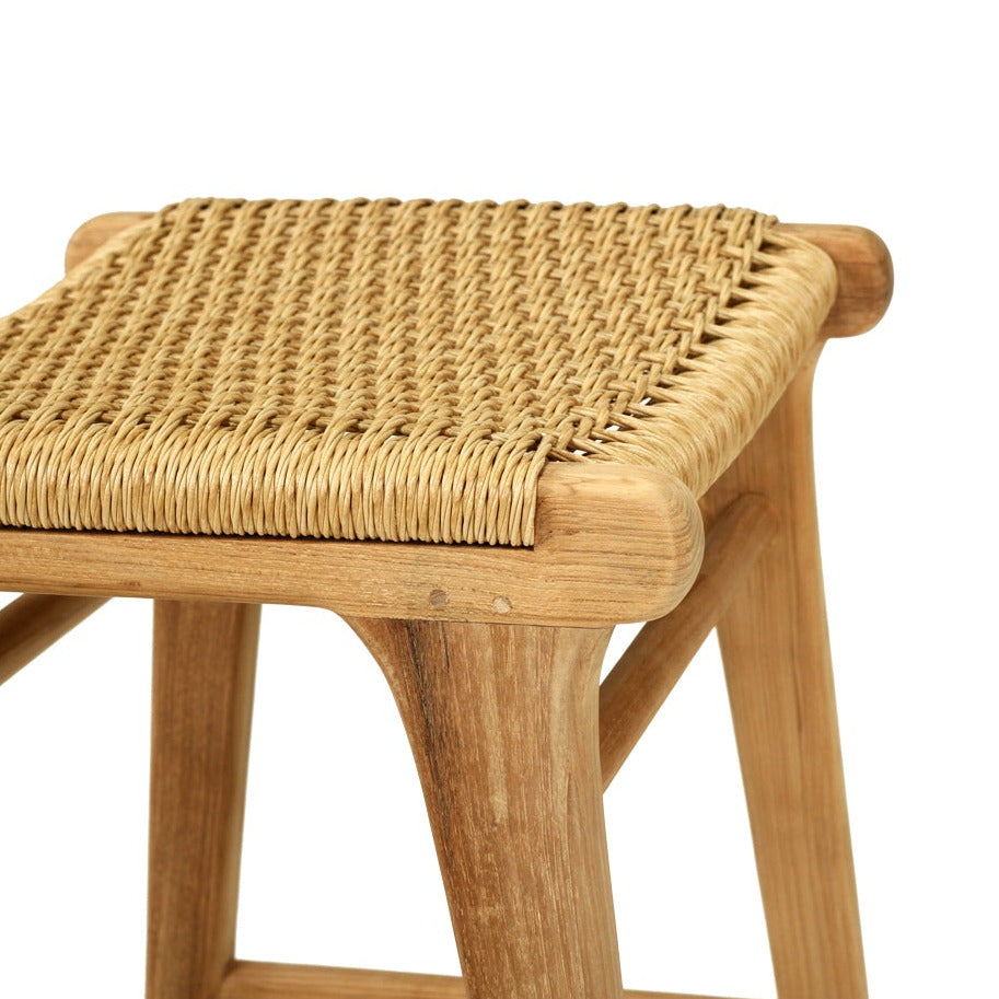 Wooden stool with woven seat on a white background