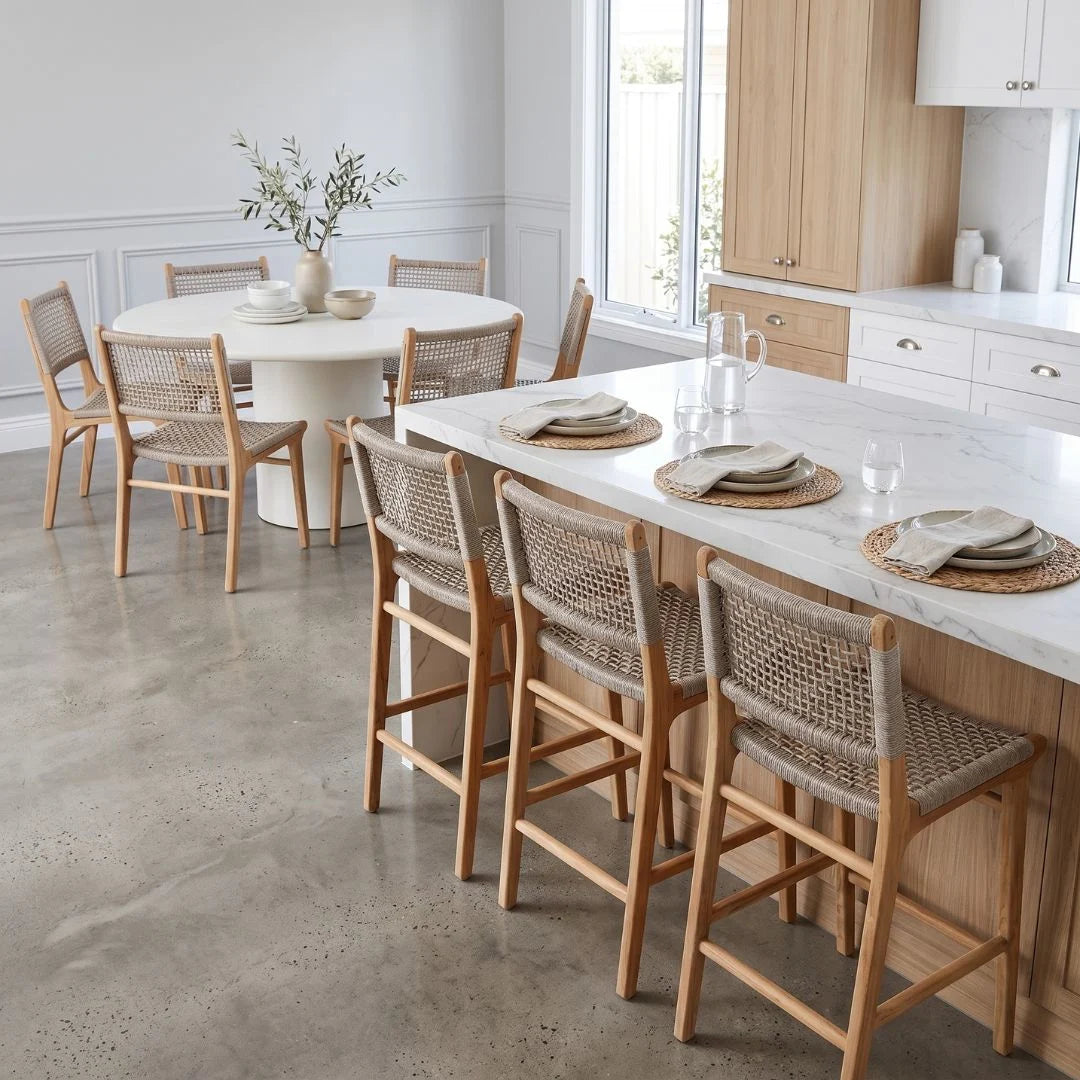 Modern kitchen with marble island and wooden chairs