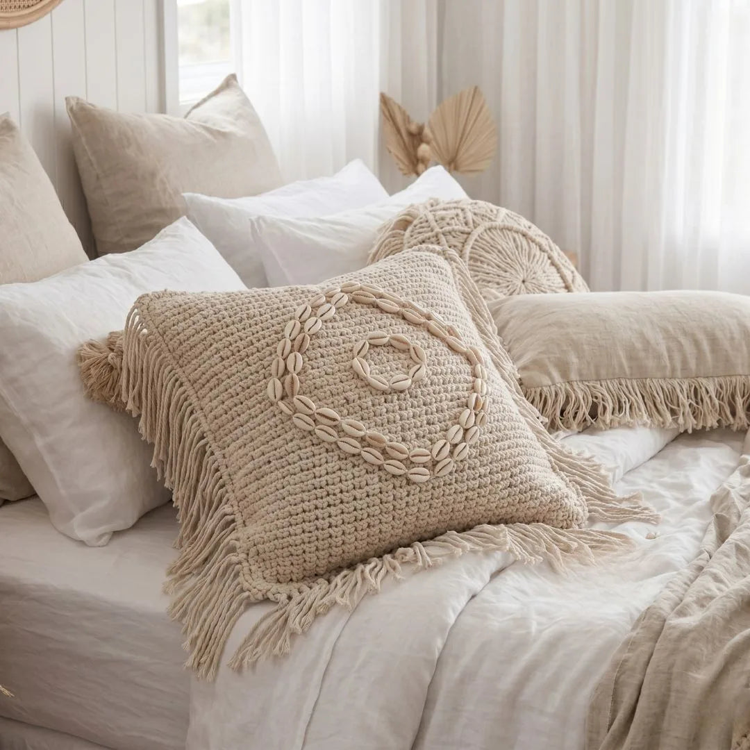 Cozy bedroom with textured pillows and a blanket