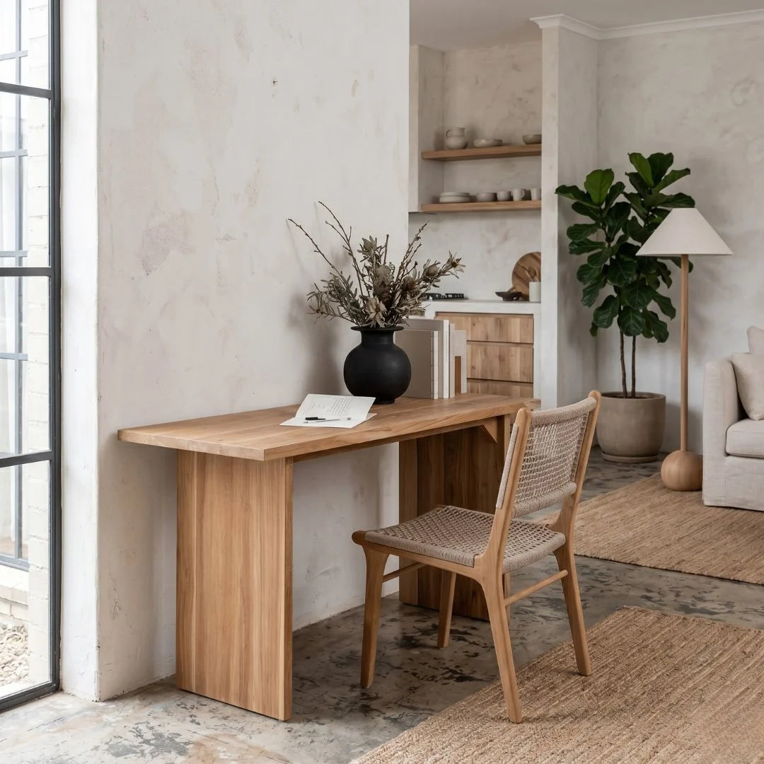 Wooden desk with chair in a modern room with plants and decor