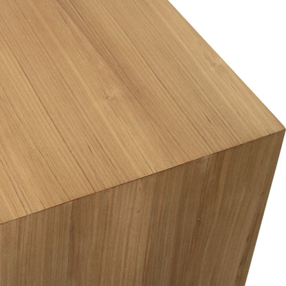 Close-up of a light natural wood surface with visible grain and a clean white background.