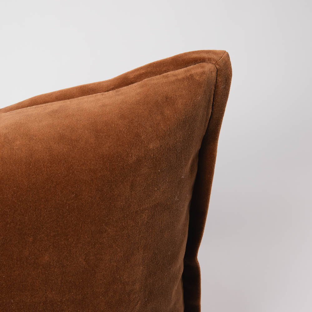 Brown pillow on a light gray background