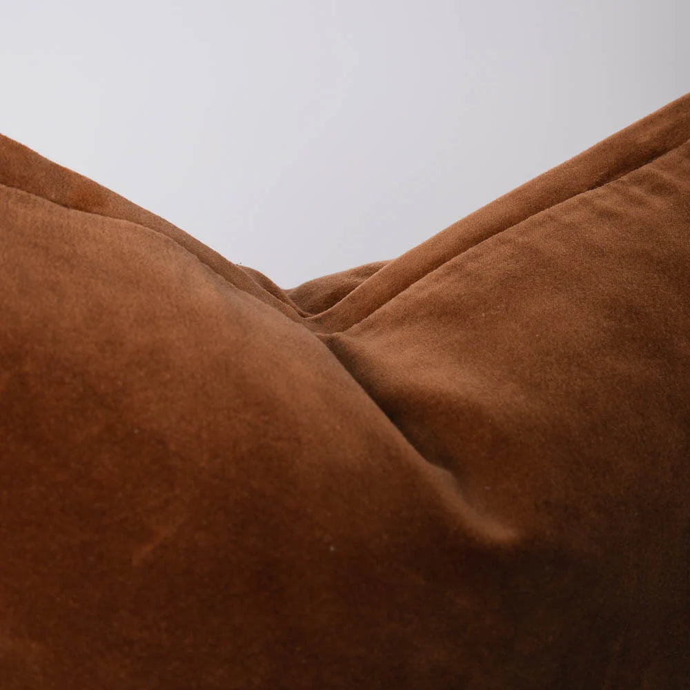 Close-up of brown fabric texture against a neutral background