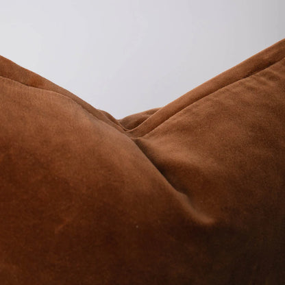 Close-up of brown fabric texture against a neutral background