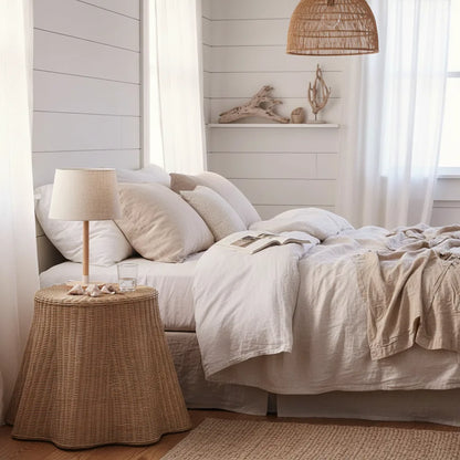 Cozy bedroom with a bed, side table, and decorative elements.