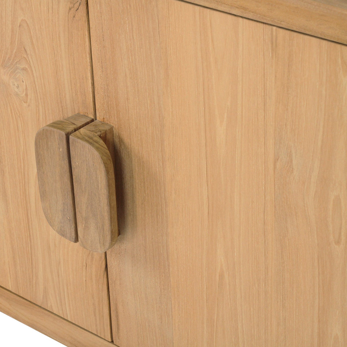 Close-up of a light natural wood cabinet with a distinctive split wooden door handle, showing the wood grain texture and clean lines.