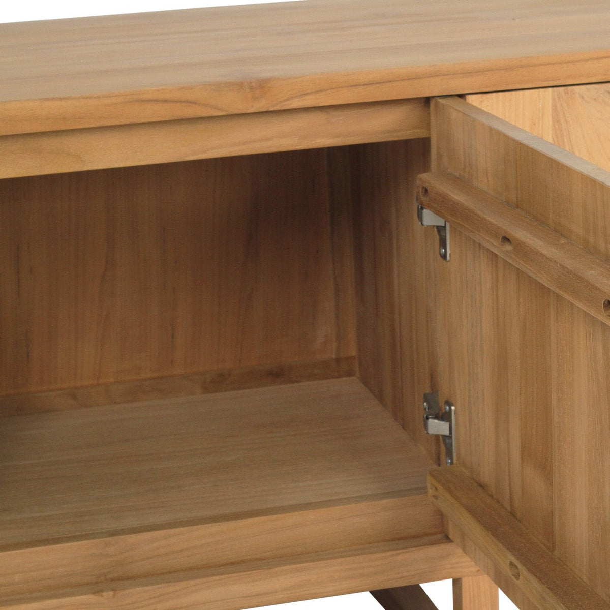 Close-up of a light natural wood cabinet with one door swung open, showing the interior shelf and metal hinges.