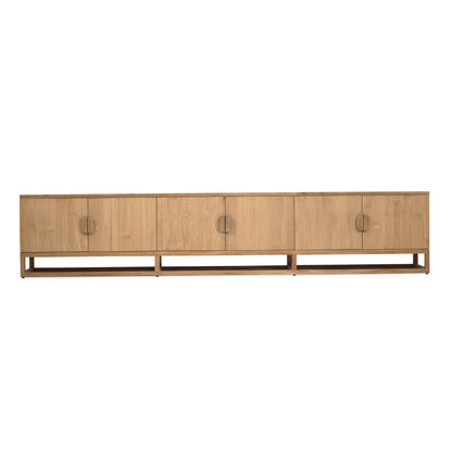 A mid-century modern wooden credenza with four cabinet doors, round metal handles, and a low open shelf base, shown against a plain white background.
