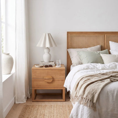 Teak Bedside table in a modern bedroom