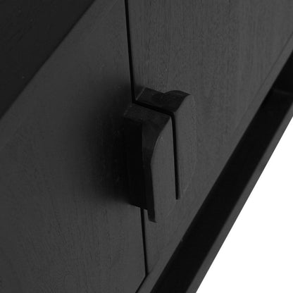 Close-up of a black teak wood cabinet door with a matte black geometric pull handle, set against a stark white background.
