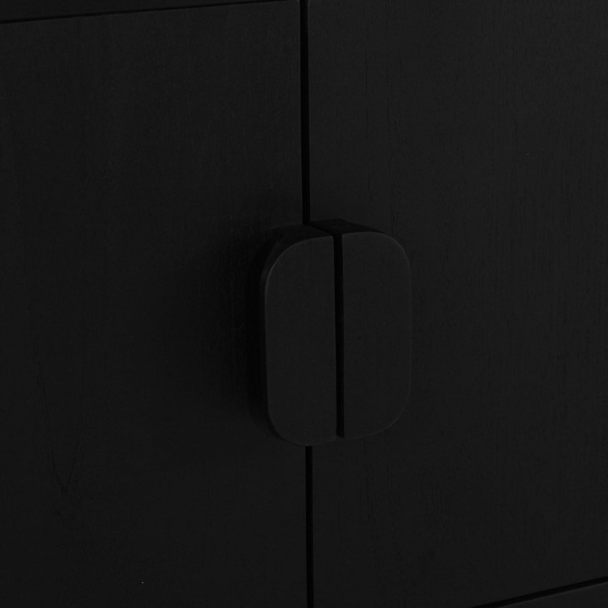 Close-up of a matte black cabinet door with a matching minimalist vertical handle.