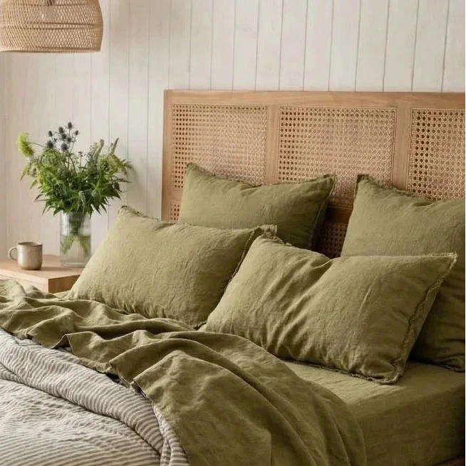 Bedroom with a wooden bed and green bedding