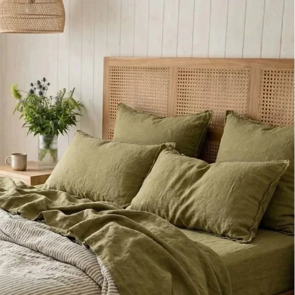 Bedroom with a wooden bed and green bedding