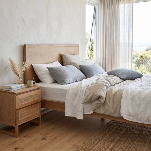 Freya American Oak bed in a modern bedroom setting.