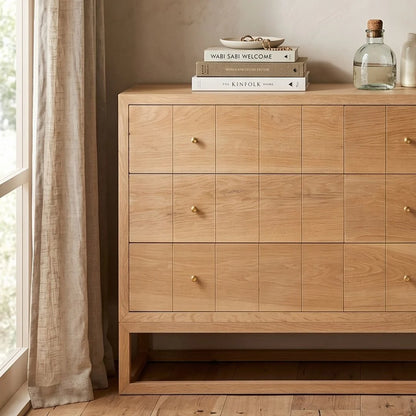 American Oak chest of drawers in a modern coastal bedroom setting.