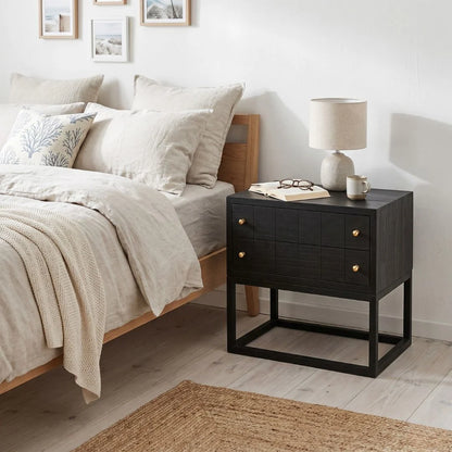 Black bedside table featured in a modern bedroom setting