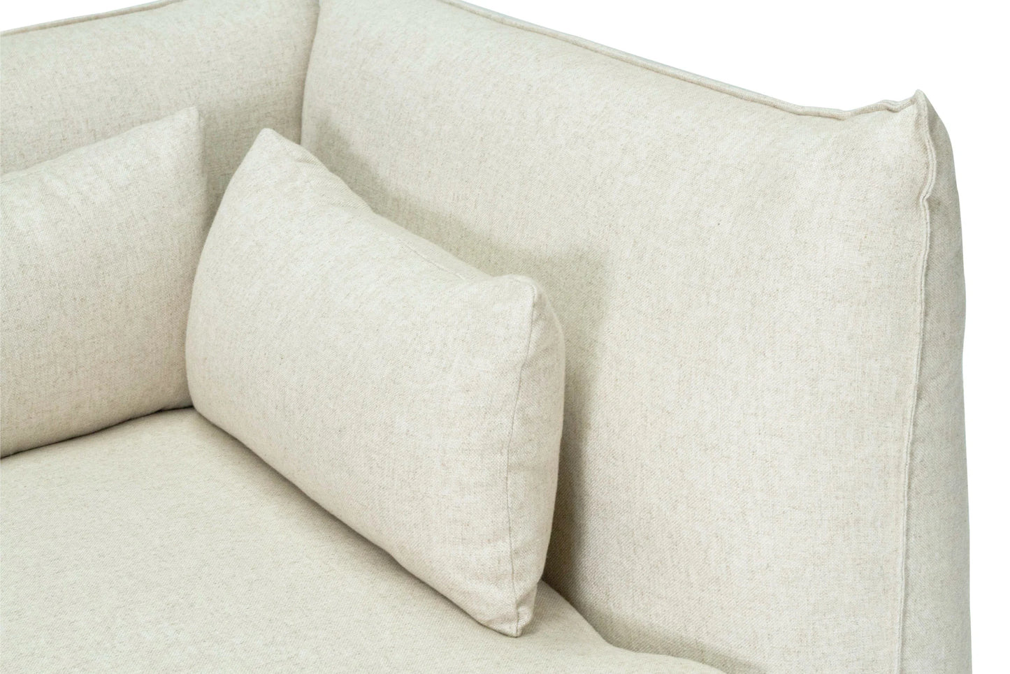 Close-up of a beige sofa with cushions on a white background