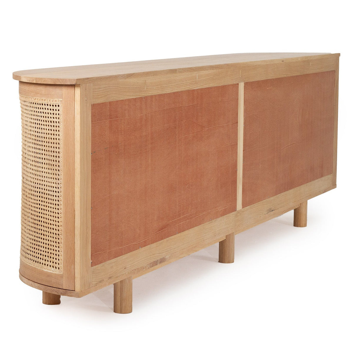A mid-century modern wooden sideboard featuring two warm reddish-brown cane panels on the front, a woven cane side panel, and short wooden legs, shown on a white background.