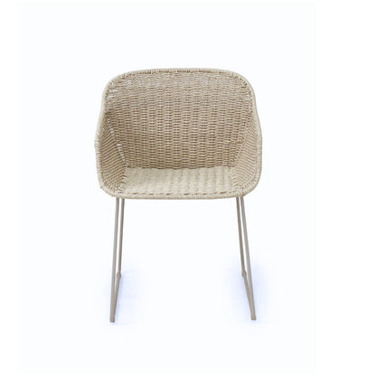 A modern outdoor dining chair with a woven beige wicker seat and backrest, supported by slim silver metal legs, shown against a plain white background.