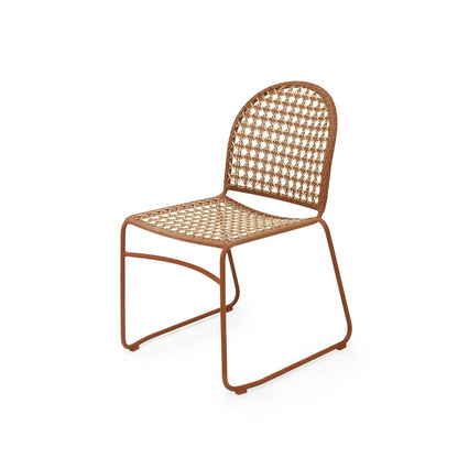 A modern side chair with a rust-brown metal frame and a woven cane seat and backrest, shown on a plain white background.