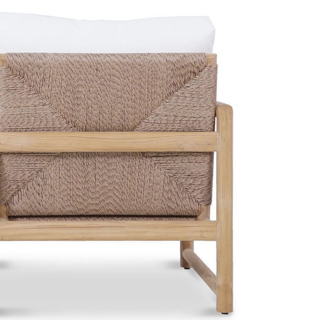 Wicker chair with woven backrest and wooden frame on a white background