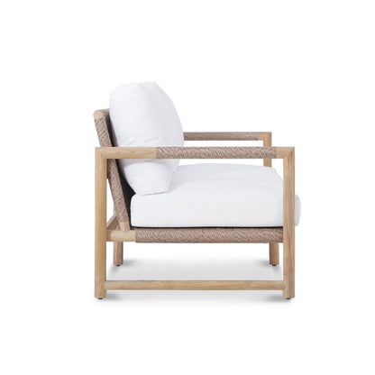 Wooden armchair with white cushions on a white background