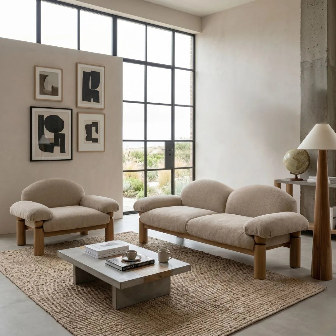 Modern living room with beige sofa, armchair, and coffee table.