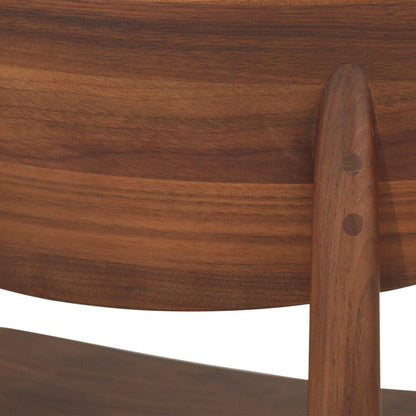 Close-up detail of a wooden chair showing the curved backrest, vertical support post, and visible double dowel joinery against a white background.