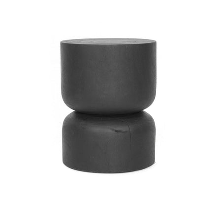 Black round stump stool side table on a white background