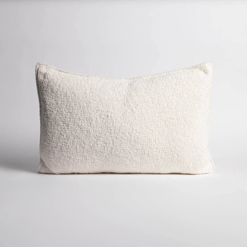 Textured white pillow on a light gray background