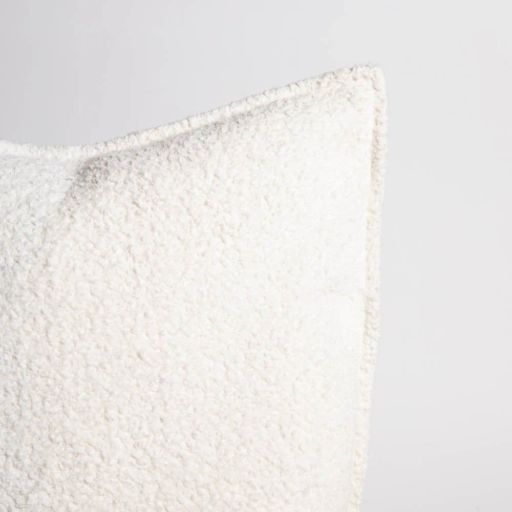 Textured white pillow on a light gray background