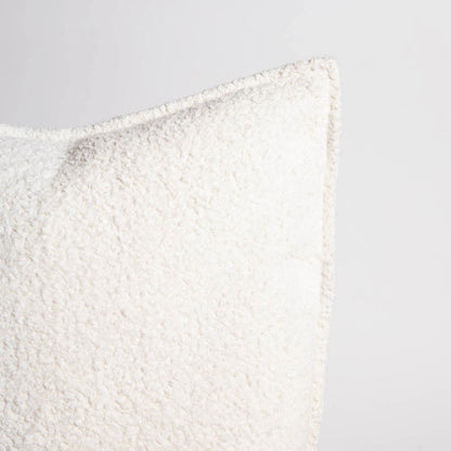 Textured white pillow on a light gray background
