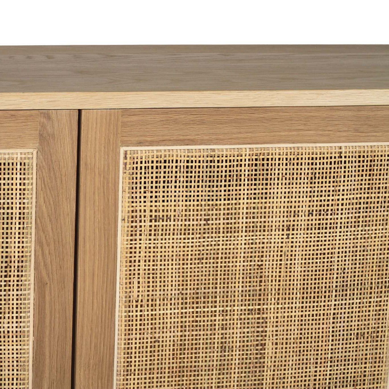 Wooden cabinet with rattan doors on a white background